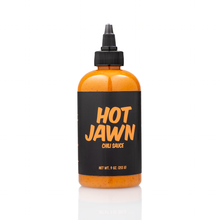 Load image into Gallery viewer, A single bottle of Hot Jawn Chili Sauce on a white background 
